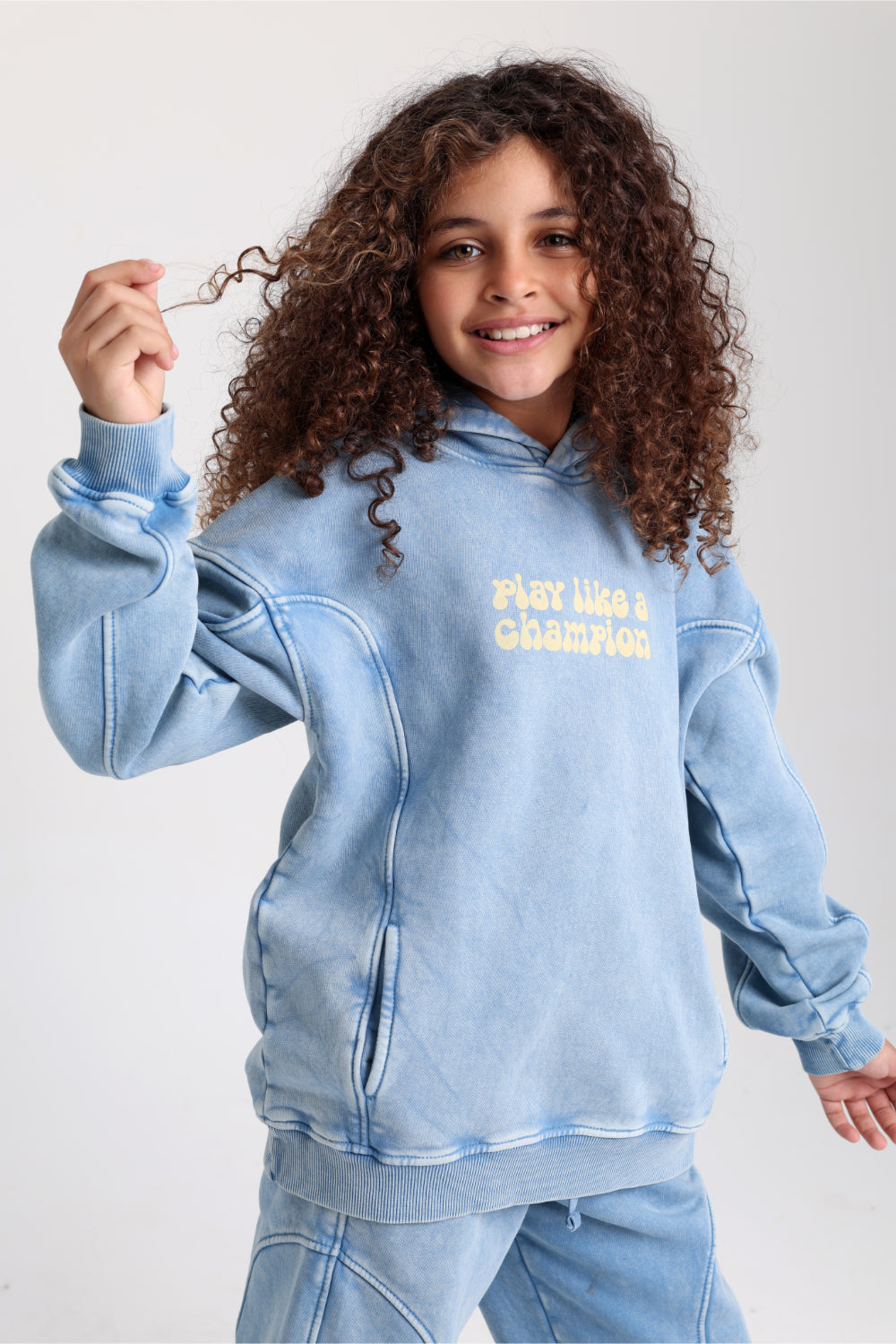 unisex cotton hoodie – baby blue with "play like a champion" print